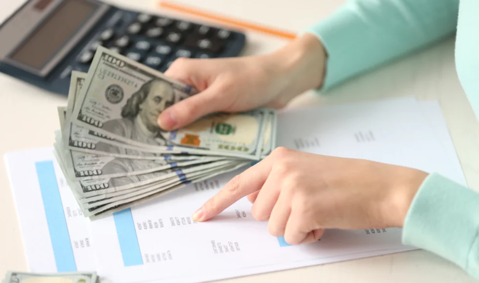 Woman calculating child support, is child support based on income or net worth?